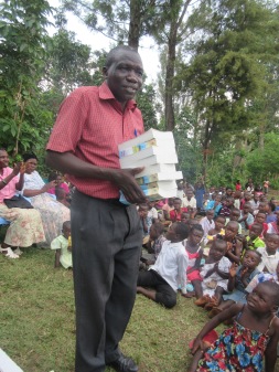 Pastor Matiya receiving donated Bibles